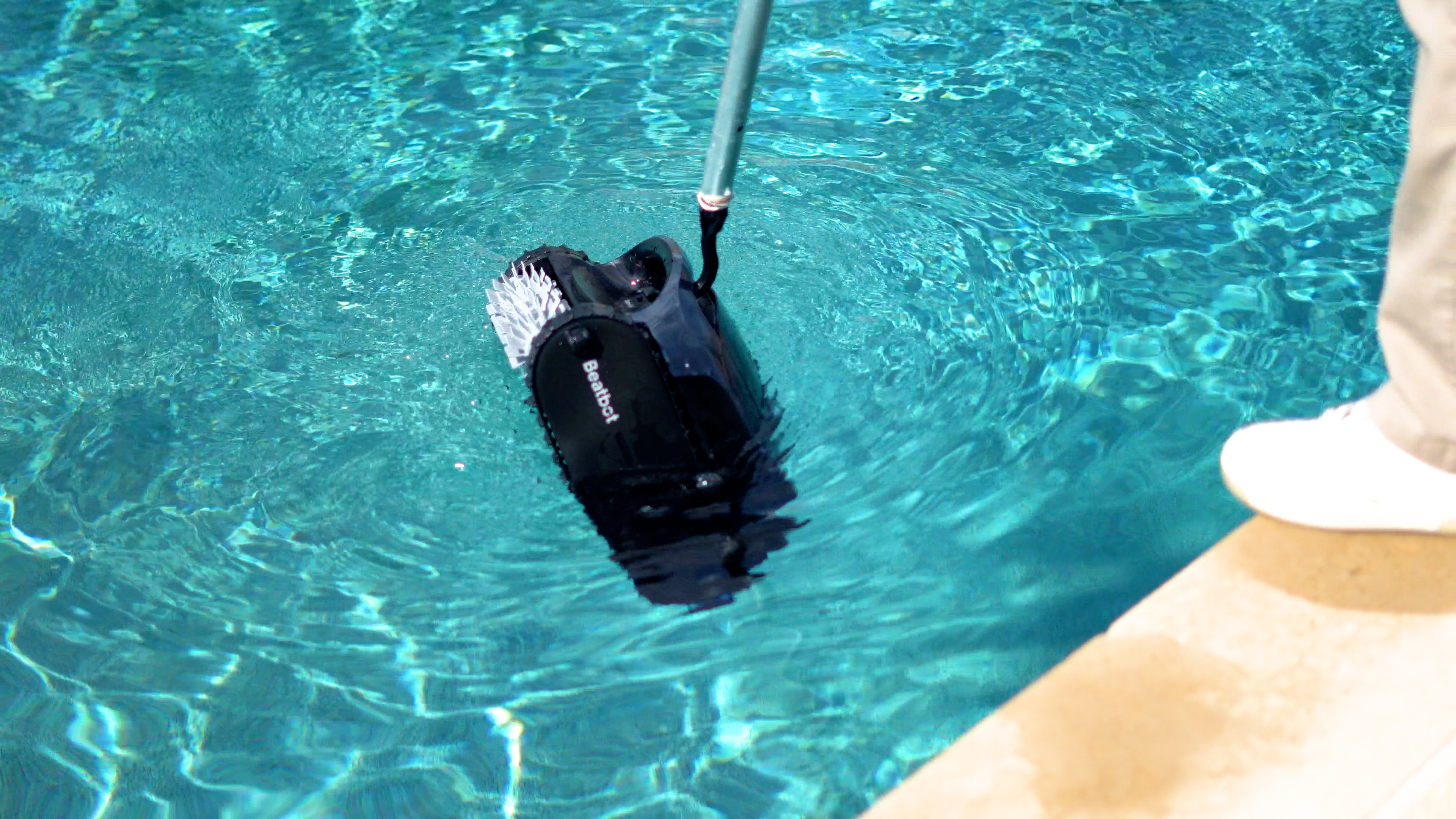 Beatbot AquaSense 2 Entering Pool Water With Pole