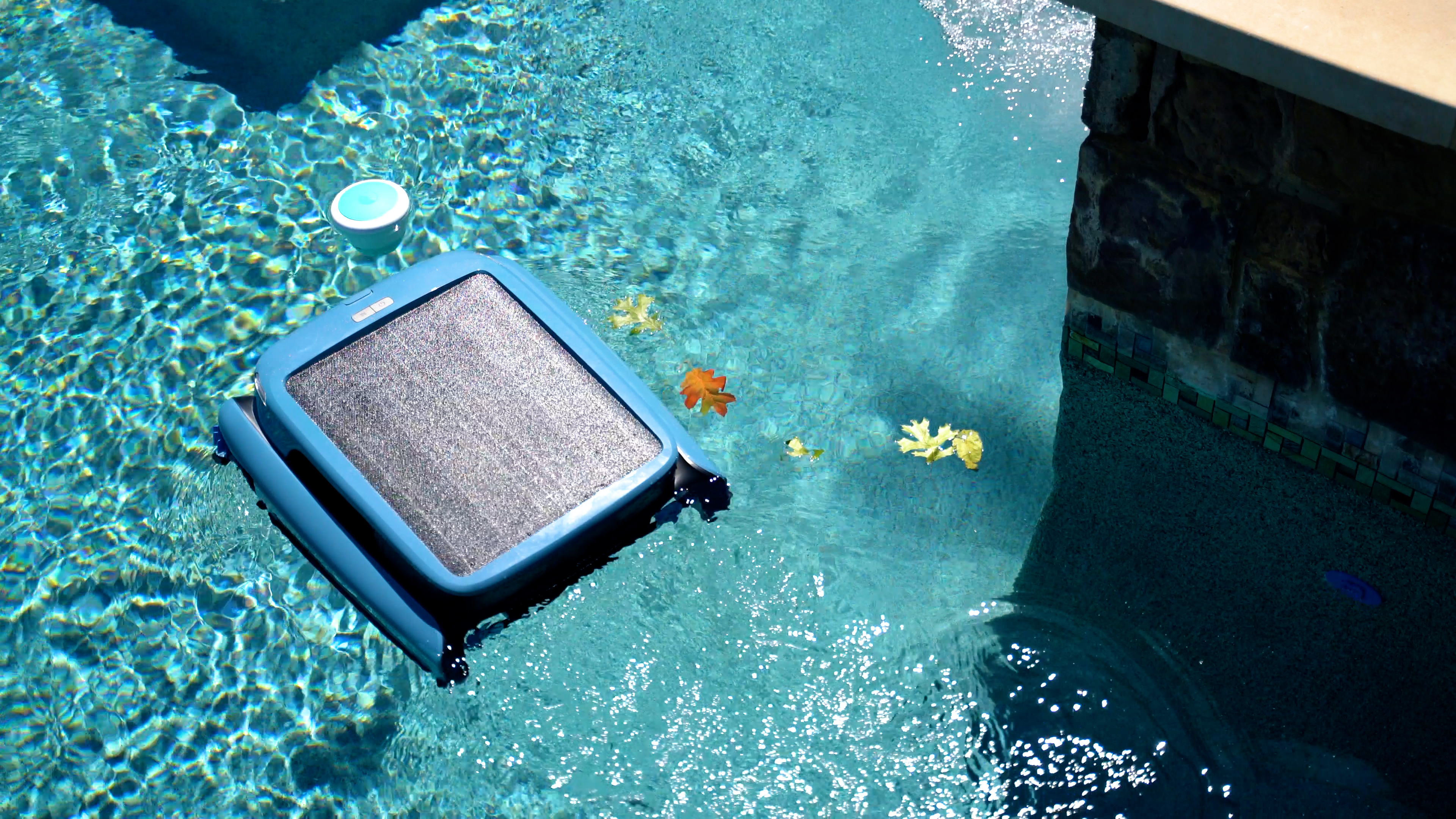 Beatbot iSkim Ultra Beatbot Iskim Ultra Floating Near Pool Edge Leaves Visible