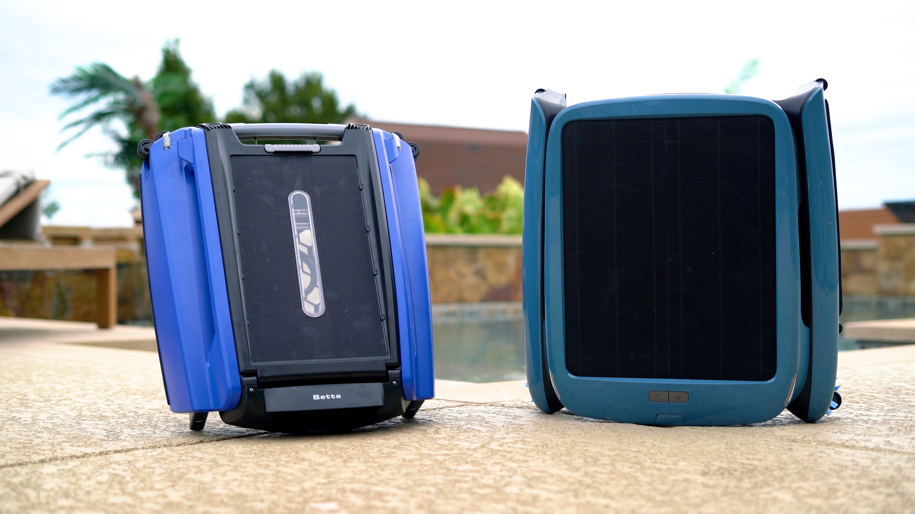 Beatbot iSkim Ultra Beatbot Iskim Ultra Two Robots Standing Upright Poolside