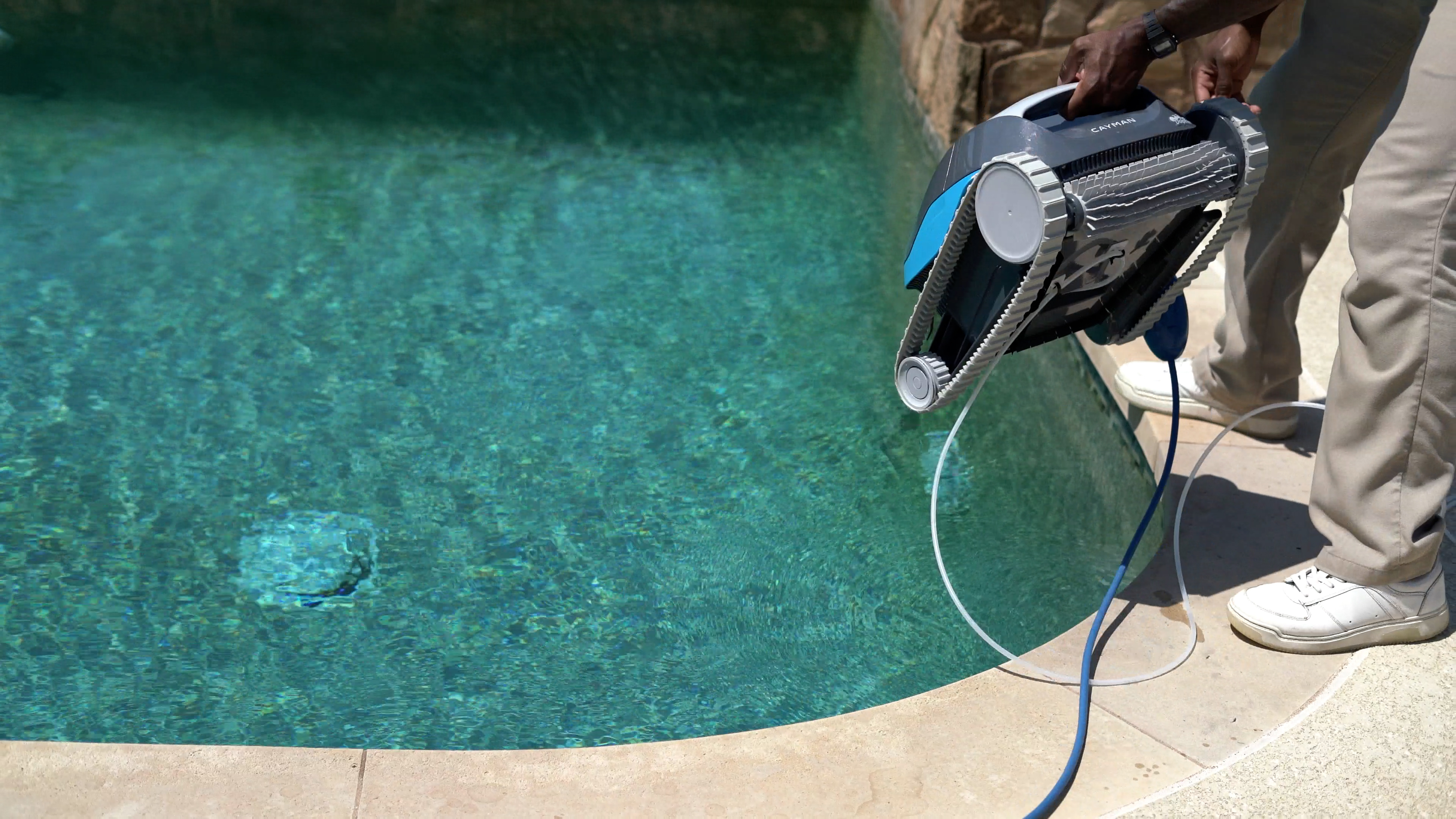Dolphin Cayman Person Lowering Robot Into Pool