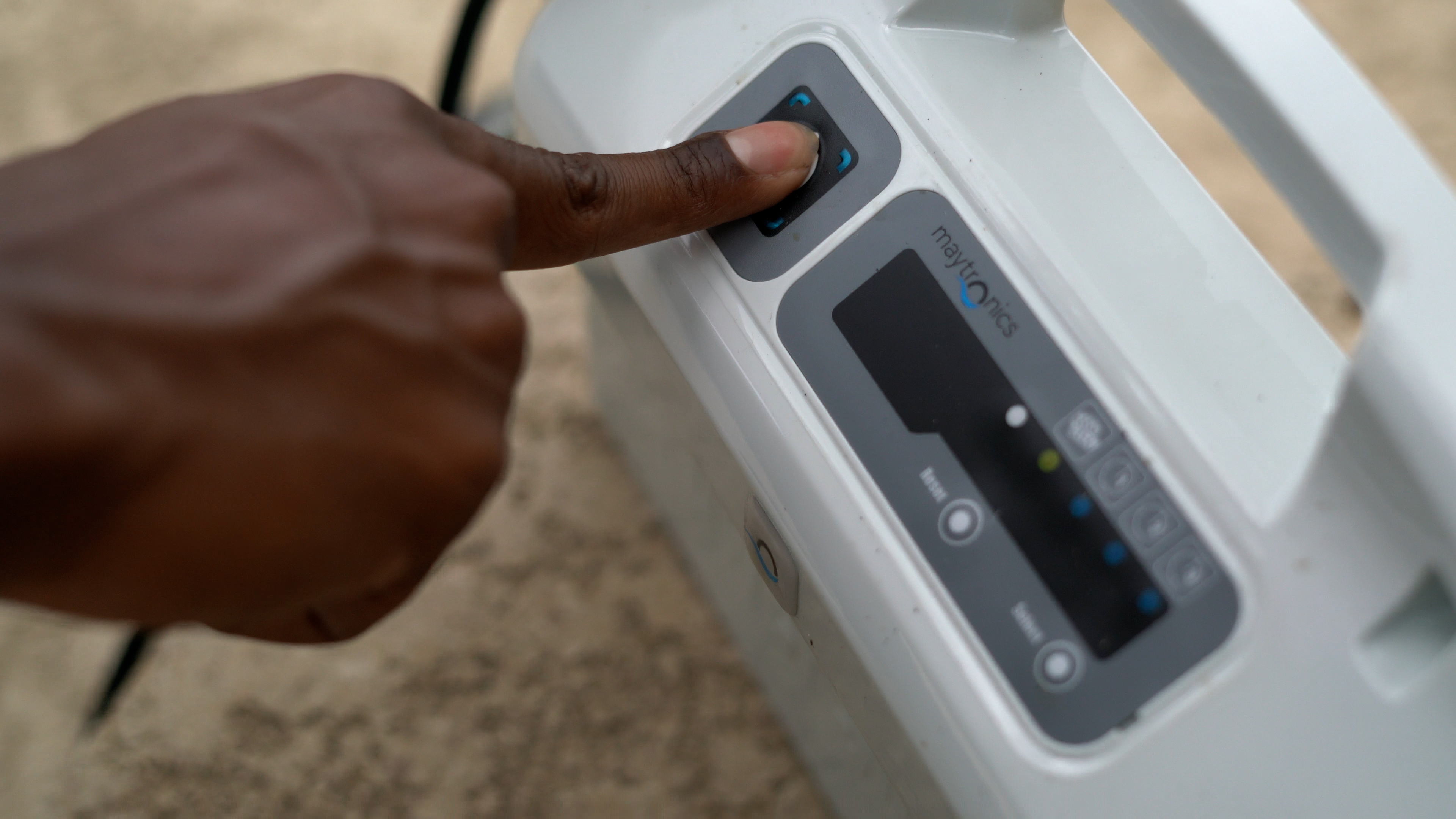 Dolphin Premier Finger Pushing Button On Control Panel