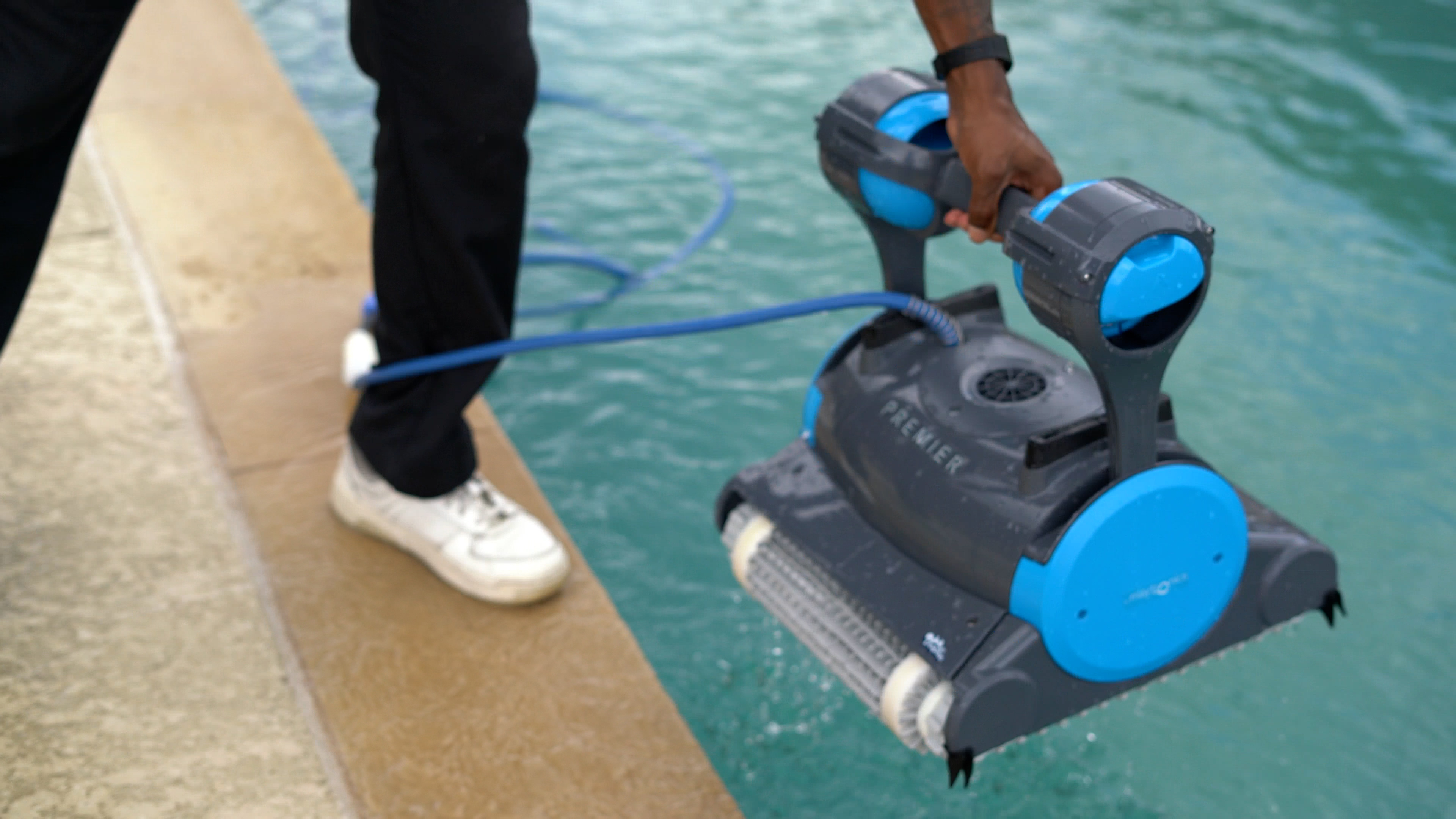 Dolphin Premier Hand Lowering Robot Into Swimming Pool