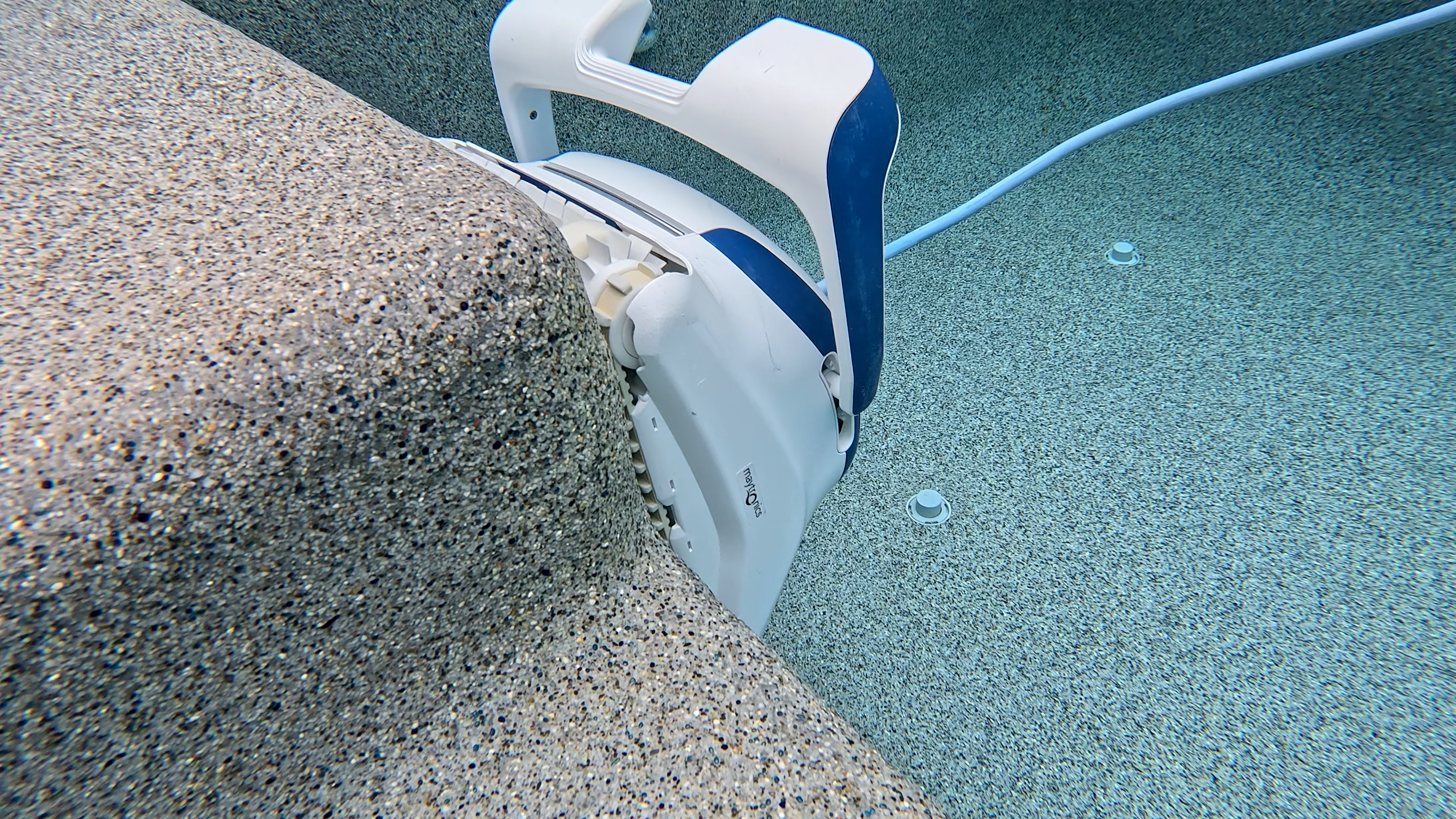 Dolphin Sigma Angled View Cleaning Pebble Tec Underwater