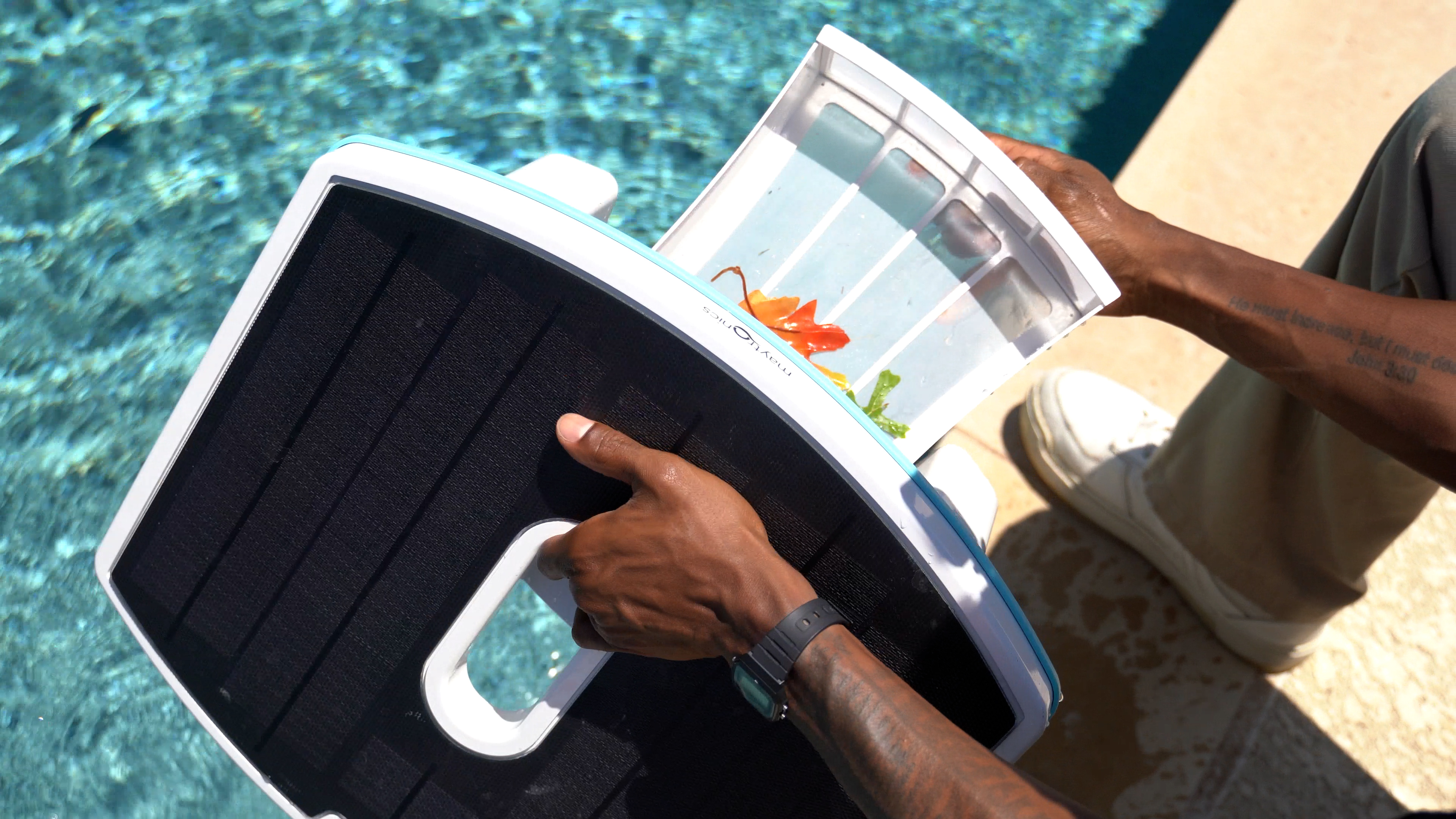 Dolphin Skimmi Hand Removes Filter Showing Collected Debris