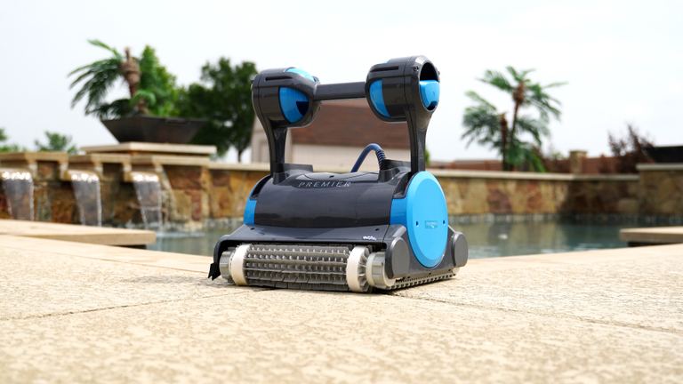 Dolphin Premier Robot On Pool Deck Waterfall Background