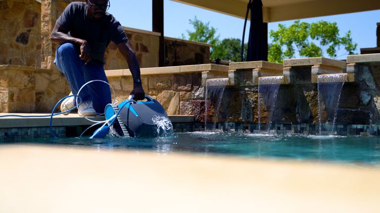 Dolphin Escape Man Lowering Robot Into Waterfall Pool