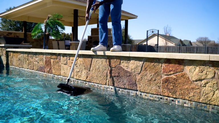 Beatbot Aquasense 2 Ultra Person Placing Robot Into Pool