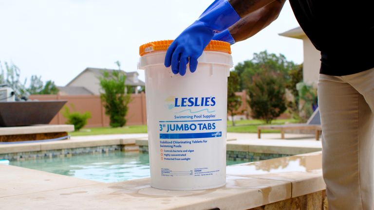 Leslies 3 Inch Jumbo Tabs Gloved Hand Resting On Orange Lid Poolside