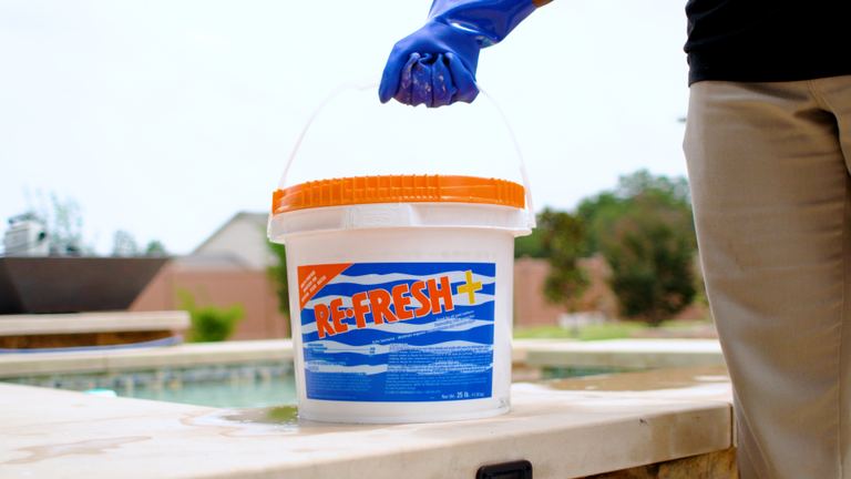 Re Fresh Plus Gloved Hand Holding Bucket Handle On Coping
