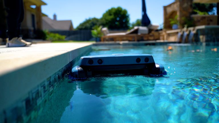 Beatbot Iskim Ultra Floating Near Tiled Pool Side Person
