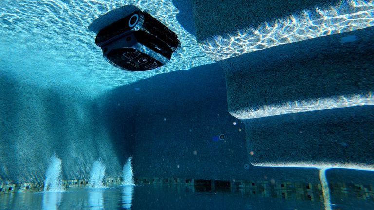 Aiper Scuba X1 Pro Cleaning Floor Underwater Near Steps