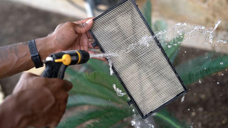 Dolphin Premier Hosing Off Filter Cartridge Water Splashing