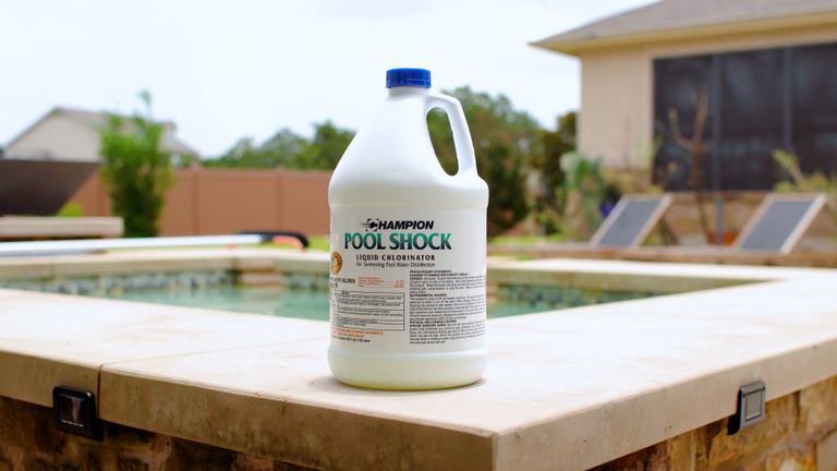 Champion Pool Shock Gallon Jug Standing On Ledge Second Angle