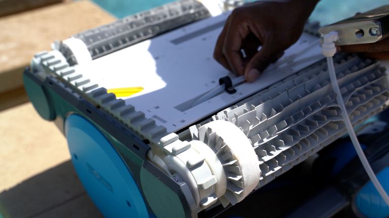 Dolphin Premier Hand Attaching Cable To Robotic Cleaner