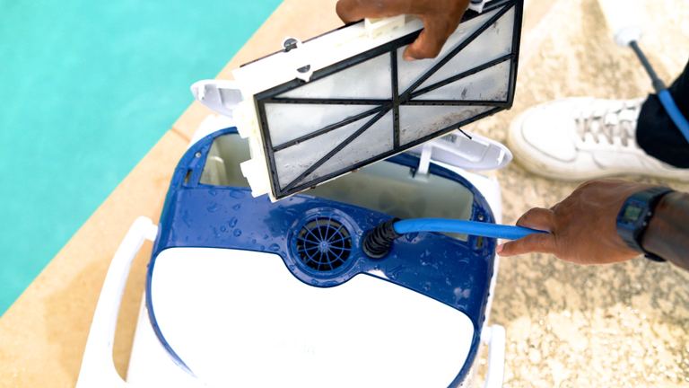 Dolphin Sigma Cleaning Dirty Filter Cassette With Water Hose