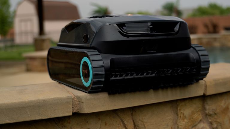 Aiper Scuba X1 Posed On Stone Ledge Side Angle