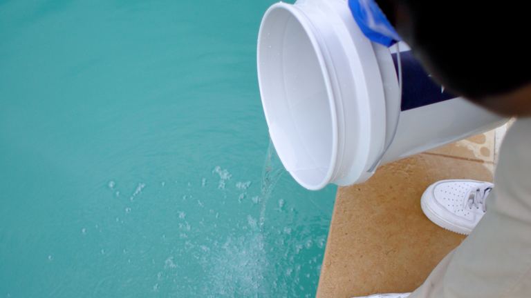 Pool Maintenance Diluted Solution Streaming Into Pool With Bubbles