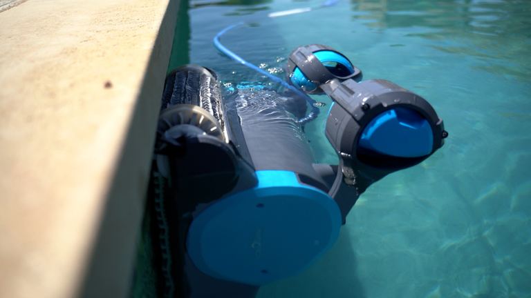 Dolphin Premier Partially Submerged Near Pool Wall Closeup